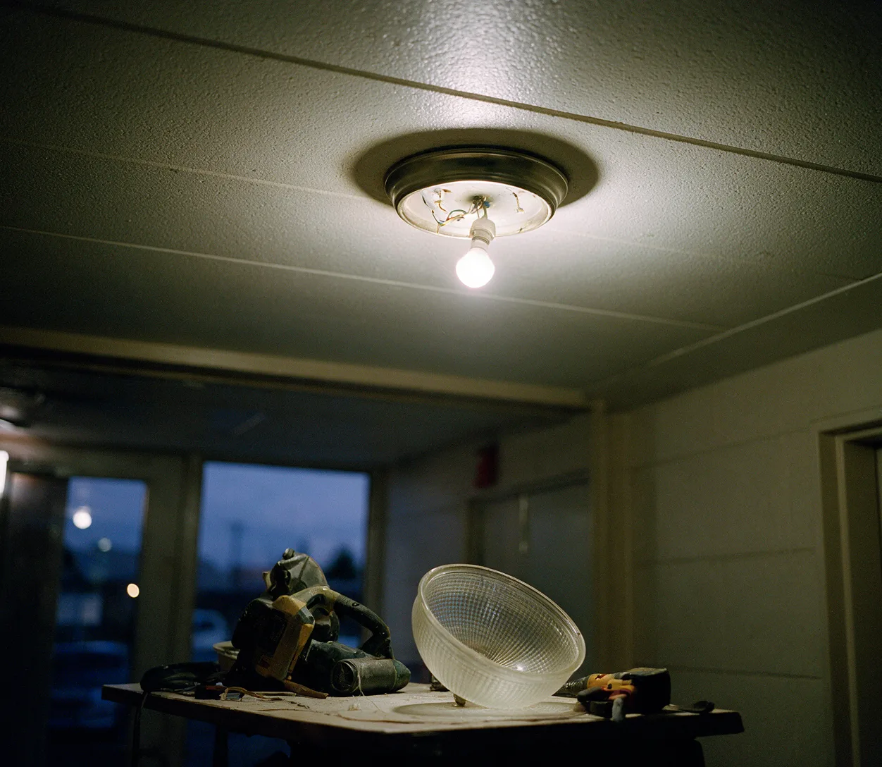 A dim ceiling light in a hallway
